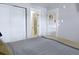 Bright bedroom featuring a modern, neutral aesthetic with an ensuite bathroom at 2636 Juniper Ave # 39-1, Boulder, CO 80304