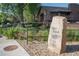 An image featuring a neighborhood sign set against the backdrop of well-maintained landscaping and a brown home at 2636 Juniper Ave # 39-1, Boulder, CO 80304