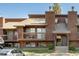 Two-story townhouse boasts wood facade, a balcony, and well-maintained landscaping, offering an inviting curb appeal at 2636 Juniper Ave # 39-1, Boulder, CO 80304