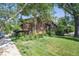 Exterior shot of a well-maintained brown home with mature trees and landscaping in a residential neighborhood at 2636 Juniper Ave # 39-1, Boulder, CO 80304