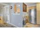 Bright kitchen featuring stainless steel appliances, wood cabinets and an open pass through window at 2636 Juniper Ave # 39-1, Boulder, CO 80304