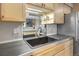 Well-appointed kitchen featuring a modern faucet, stainless steel appliances, and maple-stained cabinets at 2636 Juniper Ave # 39-1, Boulder, CO 80304