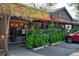 Inviting storefront with decorative planters and a bright awning, creating an appealing shopping experience at 2636 Juniper Ave # 39-1, Boulder, CO 80304