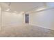 A large bedroom features recessed lighting, neutral carpet and several electrical outlets at 1073 W Powers Ave, Littleton, CO 80120
