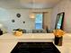 Partial view of kitchen and adjoining table, with overhead lighting illuminating the space at 1073 W Powers Ave, Littleton, CO 80120