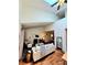 Open-concept living room boasts vaulted ceilings and a skylight that brightens the interior space at 1073 W Powers Ave, Littleton, CO 80120