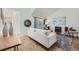 A living room with hardwood floors, a cozy couch, and ample natural light at 1073 W Powers Ave, Littleton, CO 80120