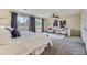 Inviting main bedroom featuring modern décor, a ceiling fan, and plush carpeting at 1073 W Powers Ave, Littleton, CO 80120