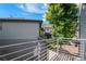 Upstairs balcony with metal railing, view of the yard and other houses at 20031 Elgin Dr, Denver, CO 80249