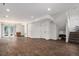 Spacious finished basement with wood tile flooring, recessed lighting, and sliding glass door to the outside at 20031 Elgin Dr, Denver, CO 80249