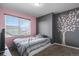 Cozy bedroom featuring a tree painted on the wall, large window, and neutral carpet flooring at 20031 Elgin Dr, Denver, CO 80249