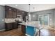Modern kitchen with granite countertops, stainless steel appliances, and island with seating at 20031 Elgin Dr, Denver, CO 80249