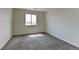 Bright bedroom with neutral walls, plush carpet, and natural light from the window creates a serene atmosphere at 7450 Lowell Blvd # B, Westminster, CO 80030