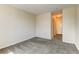 Comfortable bedroom features plush carpet, neutral walls, and a convenient doorway to the hallway and bathroom at 7450 Lowell Blvd # B, Westminster, CO 80030