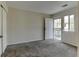 Carpeted bedroom featuring walk-out balcony door, neutral walls, and closet for convenience and comfort at 7450 Lowell Blvd # B, Westminster, CO 80030