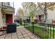 Home with a fenced patio area showing the landscape at 7450 Lowell Blvd # B, Westminster, CO 80030