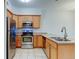 Bright kitchen featuring stainless steel appliances and wooden cabinets at 7450 Lowell Blvd # B, Westminster, CO 80030
