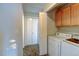 Laundry room with washer, dryer, and above cabinets, conveniently located next to the linen closet and hallway at 7450 Lowell Blvd # B, Westminster, CO 80030