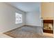 Well-lit living room featuring neutral walls, carpet flooring, and a large window for ample natural light at 7450 Lowell Blvd # B, Westminster, CO 80030