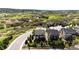 Aerial view of property nestled in a serene, hillside neighborhood with mature landscaping at 2115 Holmby Ct, Castle Rock, CO 80104