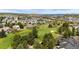 Golf course community with mature trees, manicured greens, and mountain views at 2115 Holmby Ct, Castle Rock, CO 80104