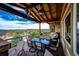 Expansive covered deck with ample seating, offering great views and outdoor relaxation at 2115 Holmby Ct, Castle Rock, CO 80104