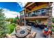 Stunning backyard with an outdoor fire pit, covered deck, and well-maintained landscaping at 2115 Holmby Ct, Castle Rock, CO 80104