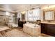 This bathroom features dual vanities, a standalone tub, and a glass shower at 2115 Holmby Ct, Castle Rock, CO 80104