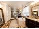 This bathroom features dual vanities, a corner tub, and a glass enclosed shower at 2115 Holmby Ct, Castle Rock, CO 80104
