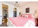 This bedroom has a door to the hall, a closet, and a large bed at 2115 Holmby Ct, Castle Rock, CO 80104