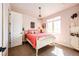 This bedroom features a window, a door to the hall, and a small bed at 2115 Holmby Ct, Castle Rock, CO 80104