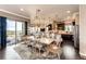 Spacious dining area and kitchen featuring a large island, pendant lighting, and dark wood floors at 2115 Holmby Ct, Castle Rock, CO 80104