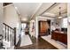 Entryway with dark wood floors and stairs to the left at 2115 Holmby Ct, Castle Rock, CO 80104