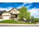 Two story home with a two car garage and a well manicured lawn at 2115 Holmby Ct, Castle Rock, CO 80104