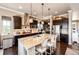 Gourmet kitchen featuring granite countertops, stainless steel appliances, and a large center island with seating at 2115 Holmby Ct, Castle Rock, CO 80104