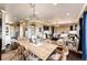 Open-concept living and dining room featuring hardwood floors, a fireplace, and stylish furnishings at 2115 Holmby Ct, Castle Rock, CO 80104