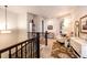 Comfortable upstairs loft area with seating, decor and reading nook adjacent to the staircase at 2115 Holmby Ct, Castle Rock, CO 80104