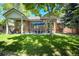 The backyard boasts a well-manicured lawn and patio area, perfect for outdoor entertaining and relaxation at 74 Blue Heron Dr, Greenwood Village, CO 80121