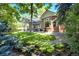 Picturesque backyard with lush green grass, patio furniture, and landscaping, creating a serene outdoor space at 74 Blue Heron Dr, Greenwood Village, CO 80121