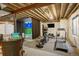 Finished basement with carpeted floors and recreational space that includes a home golf simulator and workout equipment at 74 Blue Heron Dr, Greenwood Village, CO 80121