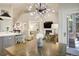 Dining area with a modern chandelier with an open view to the kitchen and living room at 74 Blue Heron Dr, Greenwood Village, CO 80121