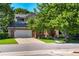 Charming brick home with mature landscaping and a spacious driveway at 74 Blue Heron Dr, Greenwood Village, CO 80121