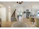 Grand foyer with a staircase leading to a living area with an open floor plan at 74 Blue Heron Dr, Greenwood Village, CO 80121