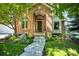Beautiful brick home with a lush front yard and inviting entrance at 74 Blue Heron Dr, Greenwood Village, CO 80121