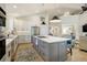 Spacious kitchen has a large island, stainless steel appliances, and an open layout at 74 Blue Heron Dr, Greenwood Village, CO 80121