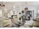 Open-concept living area showcasing high ceilings and seamless flow to the dining room at 74 Blue Heron Dr, Greenwood Village, CO 80121