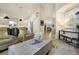 Living room with open floor plan and views into the kitchen and hallway at 74 Blue Heron Dr, Greenwood Village, CO 80121
