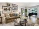 Bright and airy living space features elegant decor and a grand piano at 74 Blue Heron Dr, Greenwood Village, CO 80121