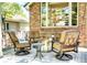 Cozy backyard patio with swivel chairs, a fire pit, and neutral outdoor rug providing a relaxing atmosphere at 74 Blue Heron Dr, Greenwood Village, CO 80121