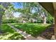 Large backyard with mature trees and a well-maintained lawn at 1637 S Stuart St, Denver, CO 80219